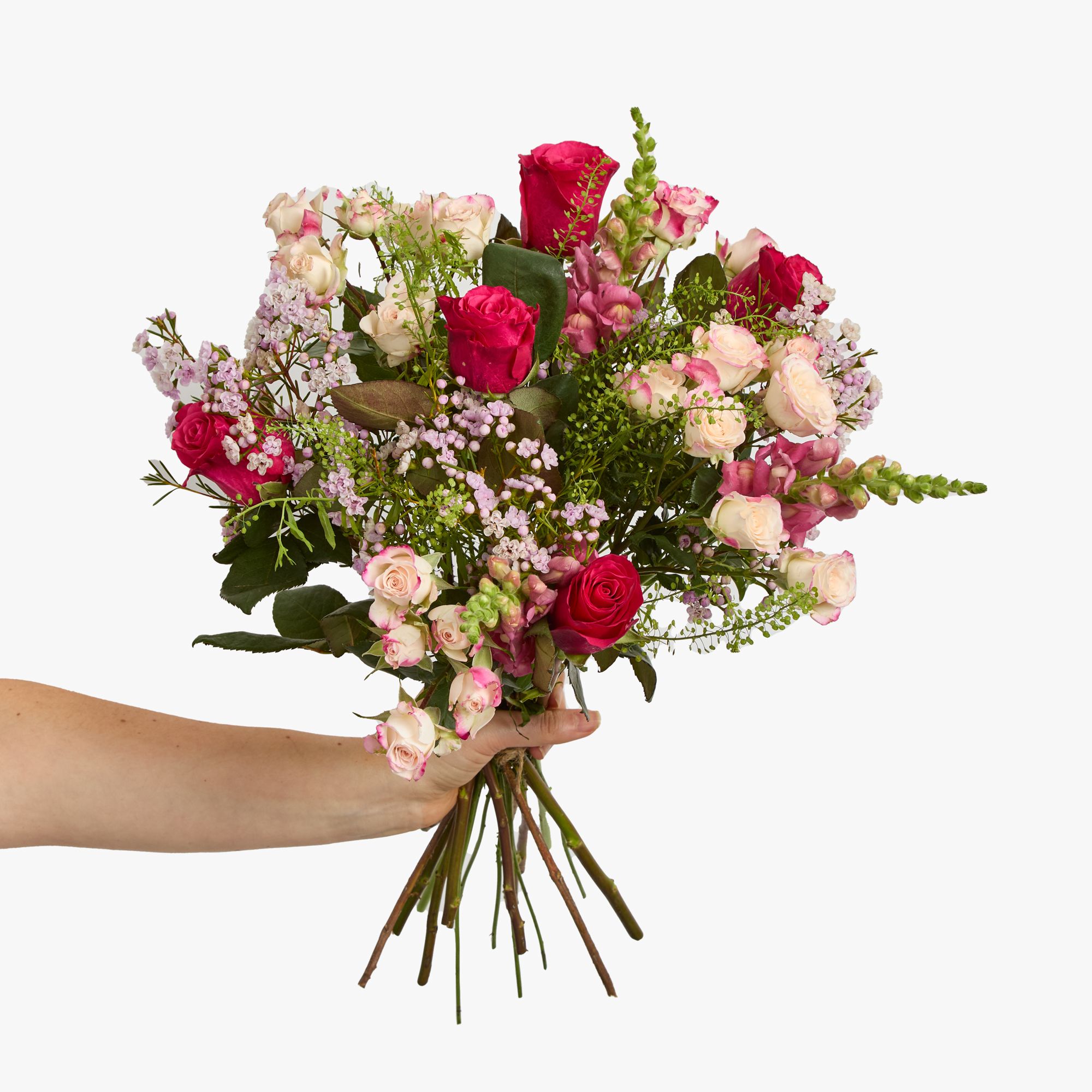 ‘Reflex’ spray rose, cerise roses, pink waxflowers, pink antirrhinum and greenbell