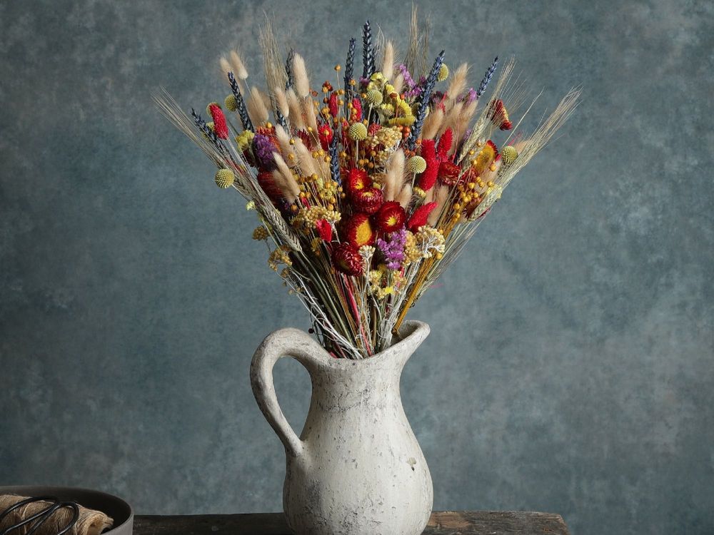 Floral flames bouquet - dried stems of natural and blue-dyed wheat, mousetails, Craspedia, Limonium and chrysanthemum.